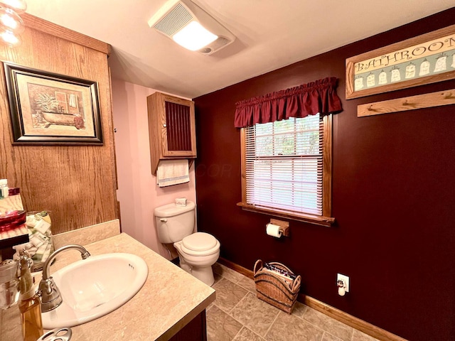 bathroom with vanity and toilet