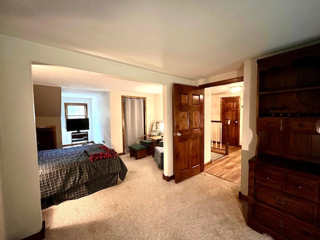 bedroom with light colored carpet