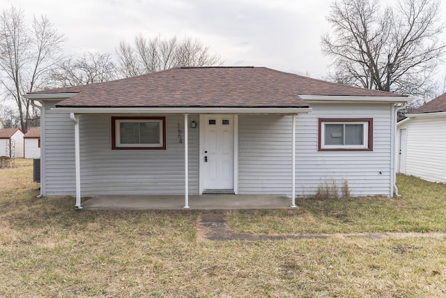 view of front of home with a front yard and a porch