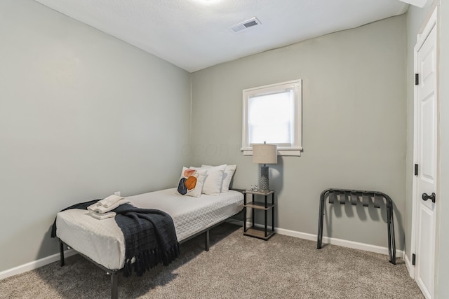 bedroom with light colored carpet