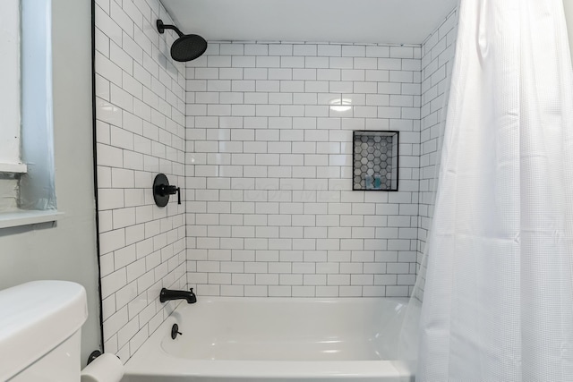 bathroom with shower / bath combo and toilet