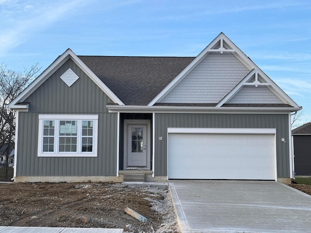 view of front of home featuring driveway and a garage