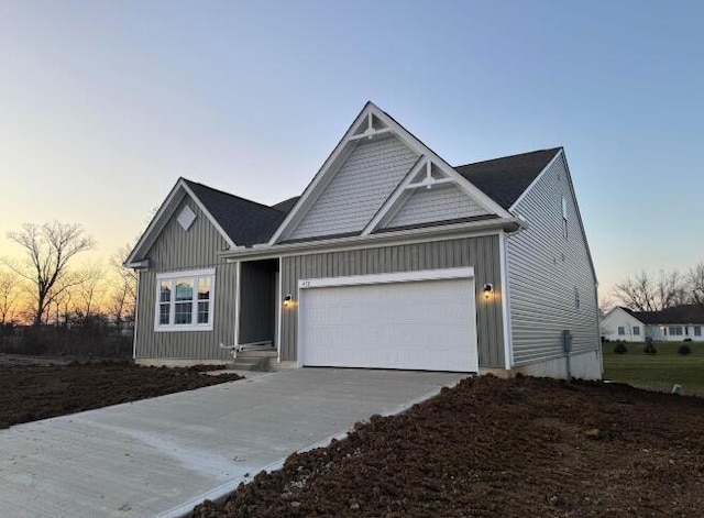 view of front of home featuring driveway, a garage, and board and batten siding