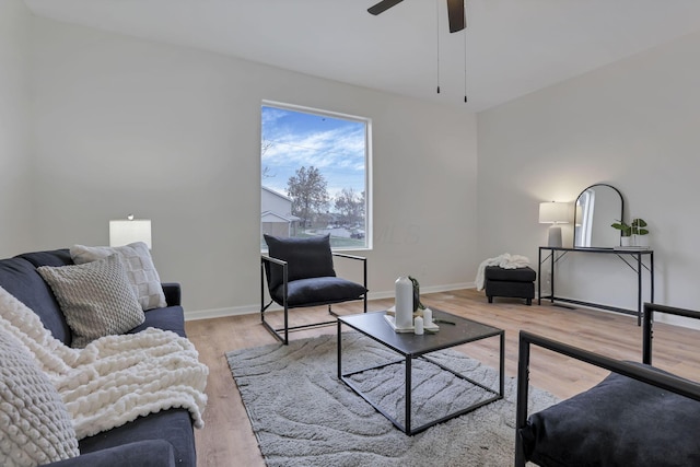 living room with hardwood / wood-style floors and ceiling fan