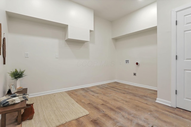 washroom featuring washer hookup, light wood-type flooring, and hookup for an electric dryer