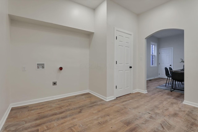 laundry area with washer hookup, electric dryer hookup, and light hardwood / wood-style floors