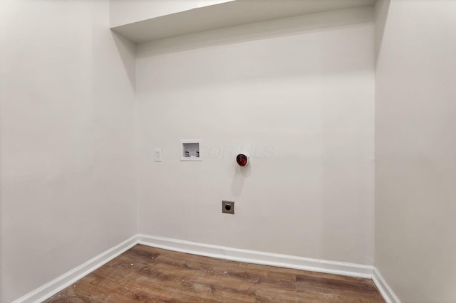 laundry area featuring hookup for a washing machine, dark hardwood / wood-style floors, and electric dryer hookup