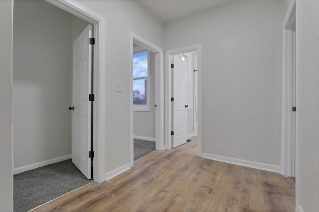 hallway with light wood-type flooring