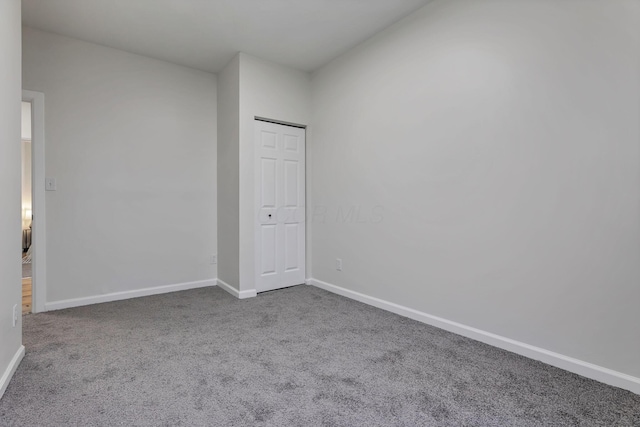 unfurnished room with carpet floors