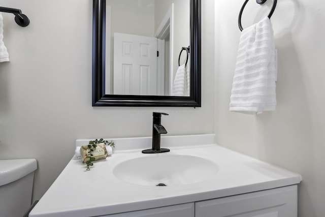 bathroom with vanity and toilet