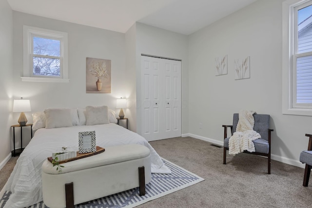 bedroom featuring carpet flooring and a closet