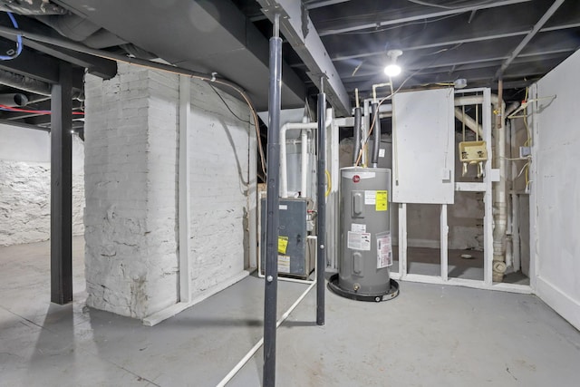 utility room featuring heating unit and water heater