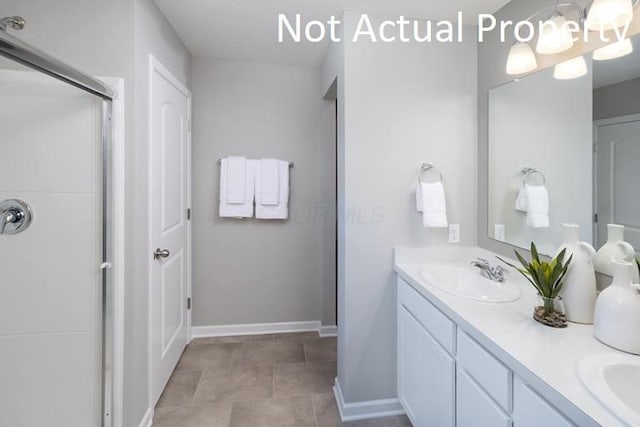 bathroom with vanity and a shower with shower door