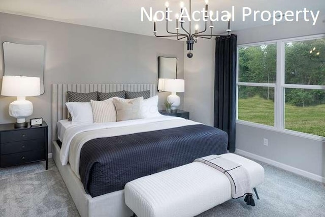 bedroom featuring carpet flooring and a notable chandelier