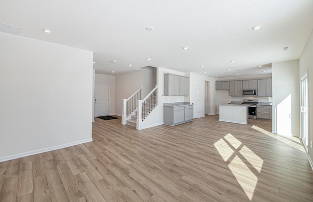 unfurnished living room with light wood-type flooring