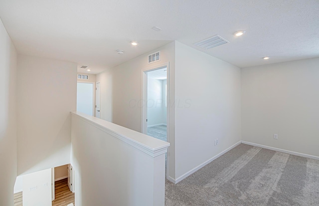 corridor featuring carpet floors