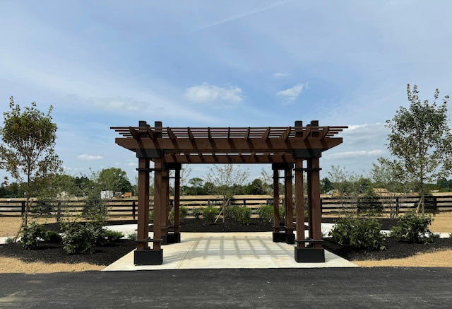 view of community featuring a patio and a pergola