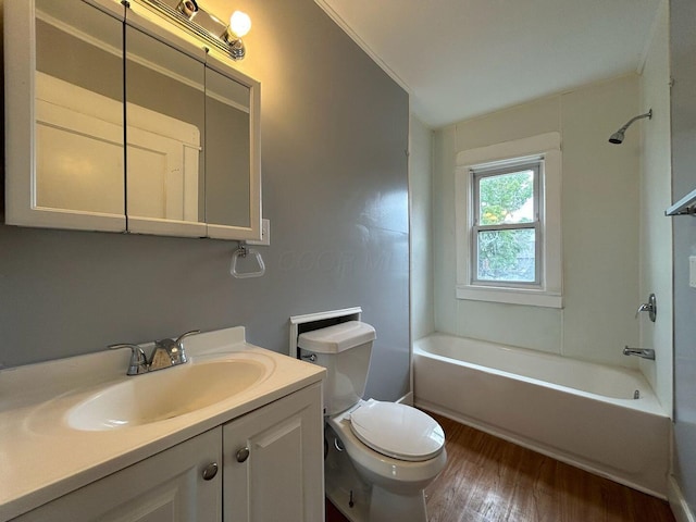 full bathroom with vanity, bathing tub / shower combination, hardwood / wood-style flooring, toilet, and ornamental molding