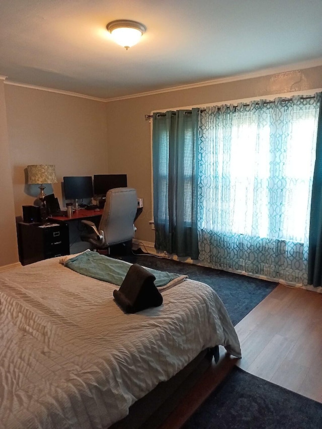 341 E 18th Ave, Columbus, OH 43201 - bedroom featuring ornamental molding, wood finished floors, and an office area