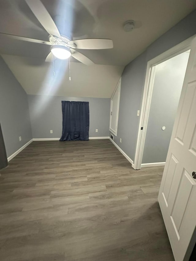 bonus room featuring hardwood / wood-style floors, ceiling fan, and lofted ceiling