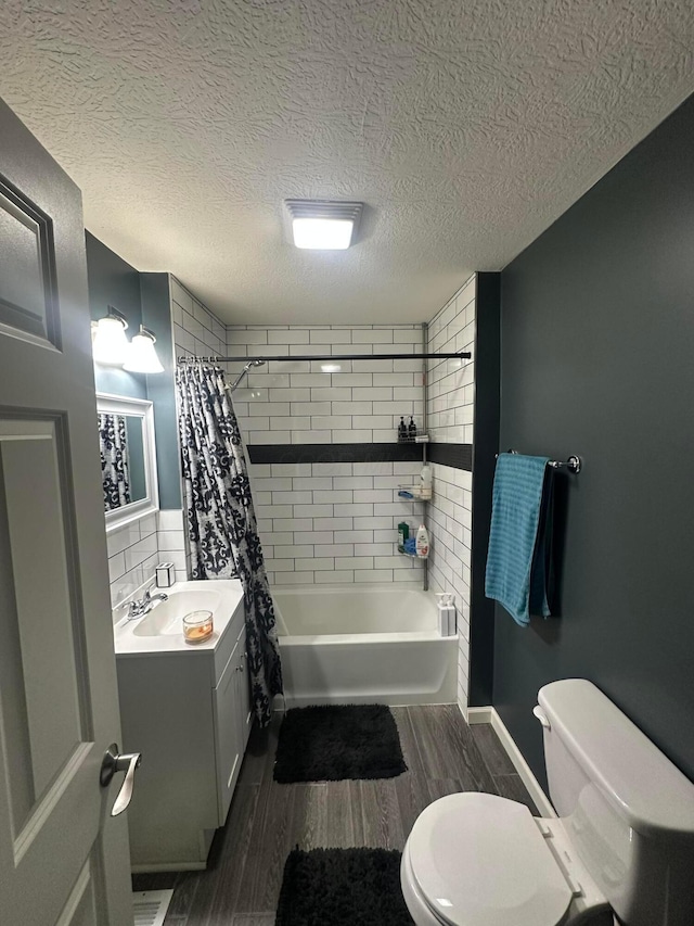 full bathroom featuring vanity, toilet, shower / bathtub combination with curtain, a textured ceiling, and wood-type flooring