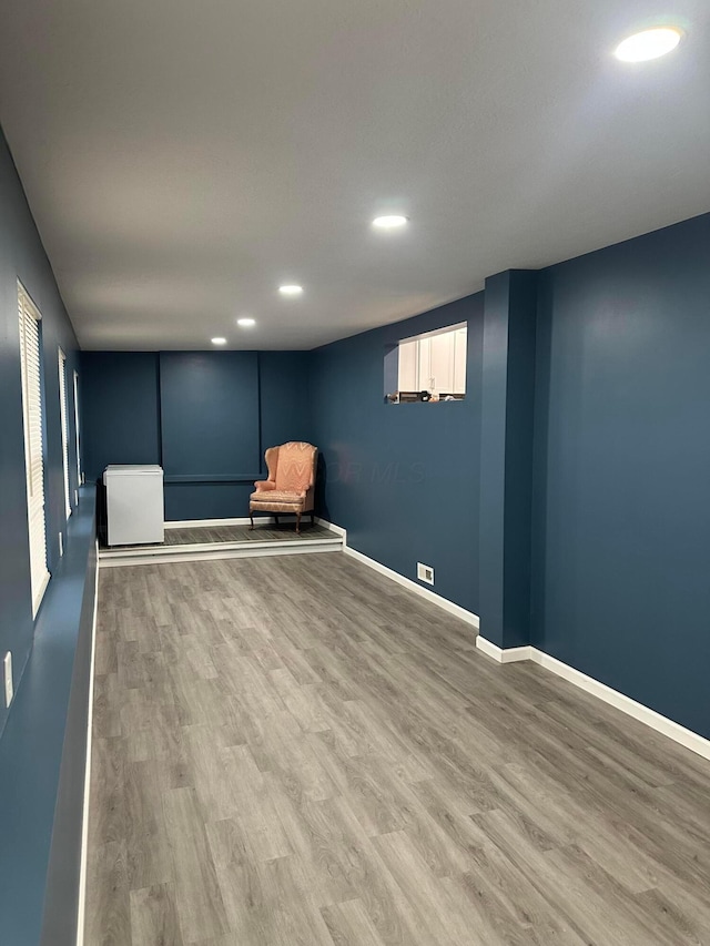 unfurnished room featuring hardwood / wood-style flooring