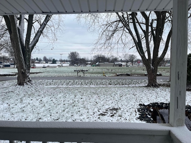 view of yard layered in snow