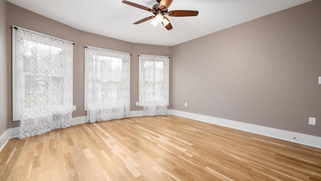 unfurnished room with ceiling fan and light hardwood / wood-style flooring