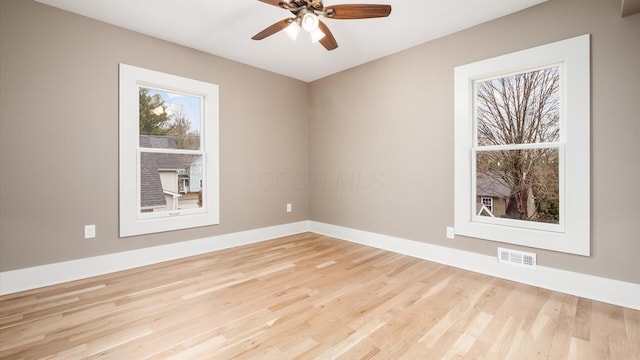 unfurnished room featuring ceiling fan and light wood-type flooring