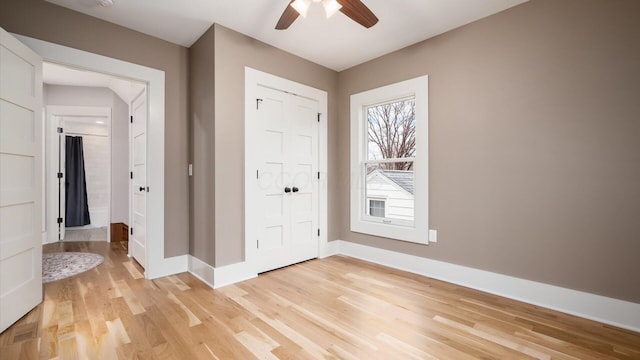 entryway featuring ceiling fan and light hardwood / wood-style floors