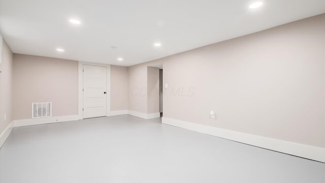 unfurnished room with concrete floors