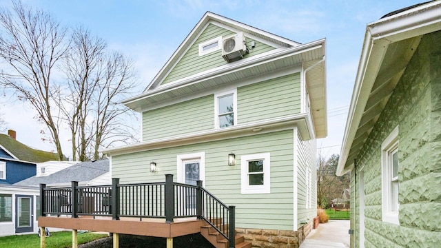 back of house with a wooden deck