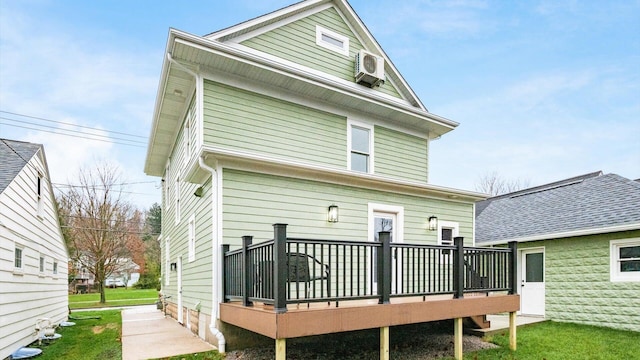 back of property featuring a wooden deck