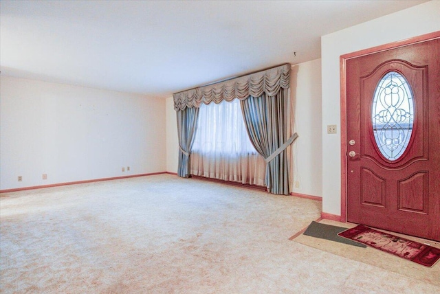 view of carpeted entrance foyer