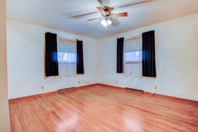 spare room featuring light hardwood / wood-style flooring and ceiling fan