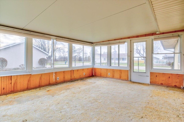 unfurnished sunroom featuring radiator heating unit