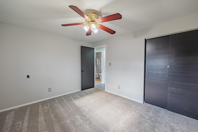 unfurnished bedroom featuring ceiling fan, carpet floors, and a closet