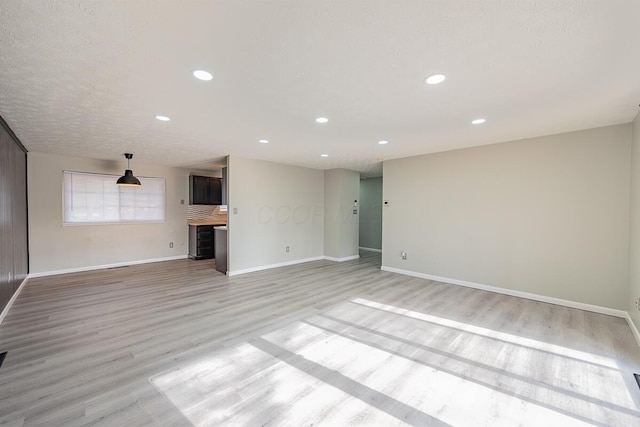 unfurnished living room featuring light hardwood / wood-style flooring