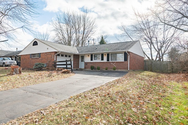 ranch-style home featuring a garage