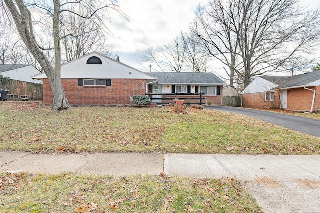 ranch-style house with a front lawn