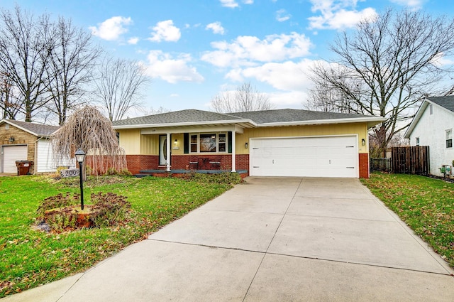 ranch-style home featuring a porch, a garage, and a front lawn