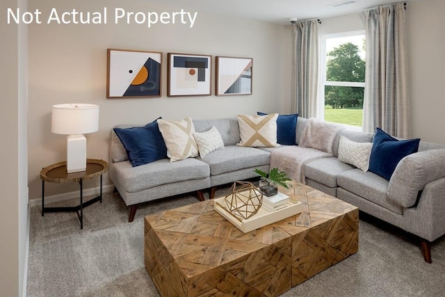 living room with carpet floors, visible vents, and baseboards