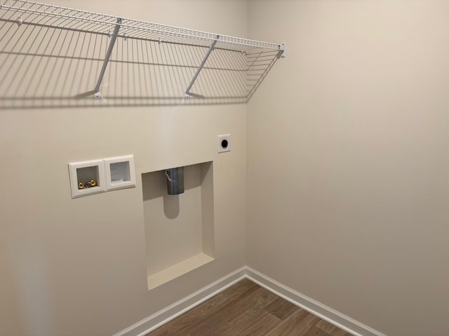 washroom with laundry area, baseboards, dark wood finished floors, washer hookup, and electric dryer hookup