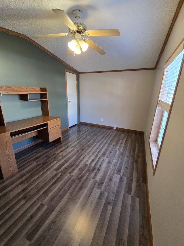 unfurnished bedroom featuring a textured ceiling, ceiling fan, dark wood-type flooring, and vaulted ceiling