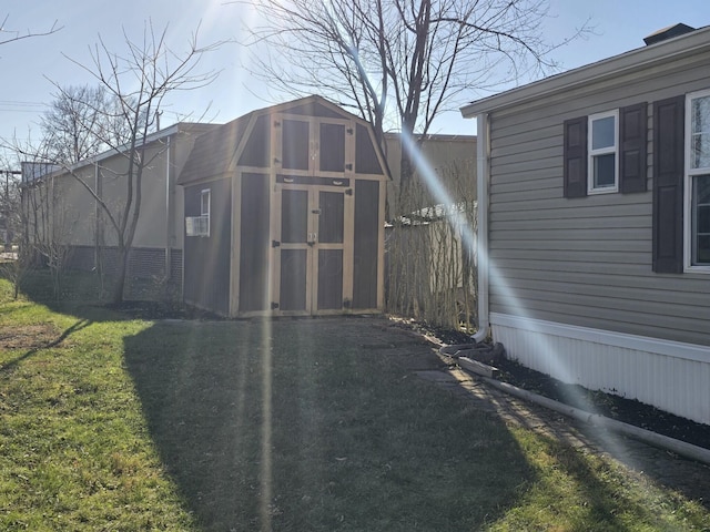 view of outbuilding with a lawn