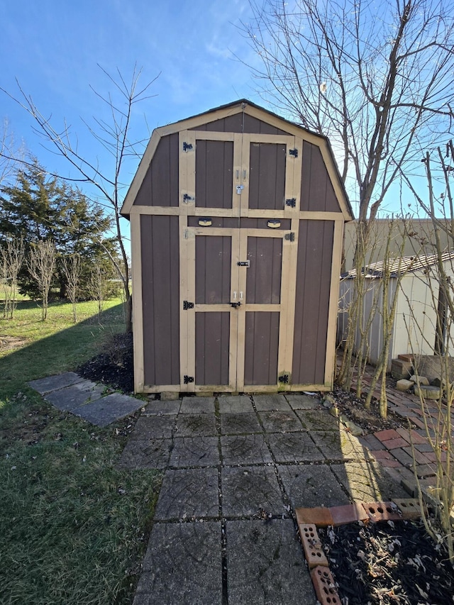 view of outbuilding with a yard