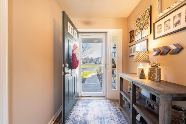 entrance foyer with a textured ceiling