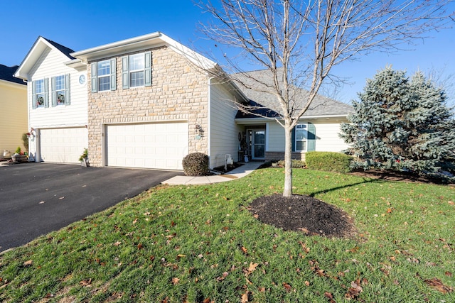 view of front facade featuring a front lawn and a garage