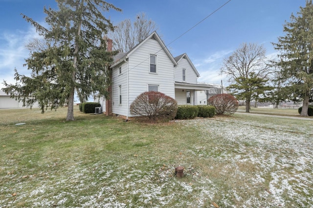 view of home's exterior with a yard