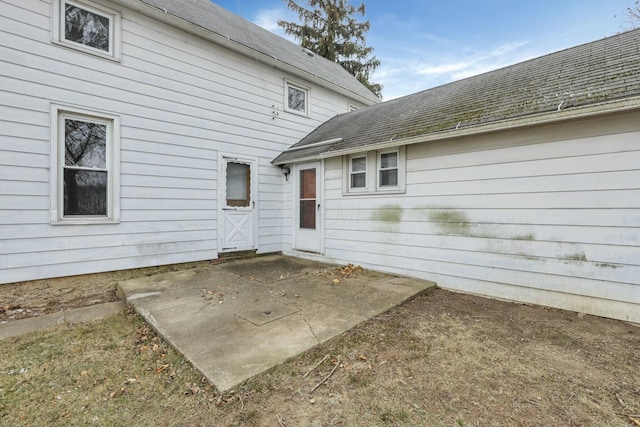 rear view of property featuring a patio area